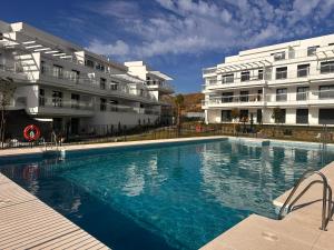 a large swimming pool in front of two buildings at Luxury La Cala de Mijas Sunset in Mijas Costa +15 photos