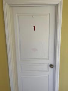 a door with the letter i on it at la paz room 1 in Fresno