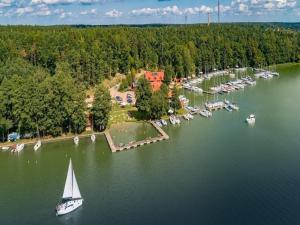 an aerial view of a lake with boats in the water at Double room, sauna, Masuria in Ruciane-Nida