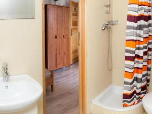 a bathroom with a sink and a shower at Triple room, sauna, Masuria in Ruciane-Nida +15 photos