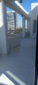 a balcony of a building with a view of a city at ORAN App in Dherinia
