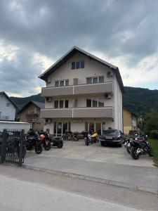 a group of motorcycles parked in front of a building at Sobe Holiday Goražde in Goražde