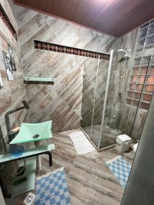 a bathroom with a shower and a sink at Casa Velha Hospedagem Jacuípe in Camaçari +24 photos