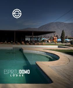 a swimming pool in front of a building at Espiritu Domo Lodge in Coinco +11 photos