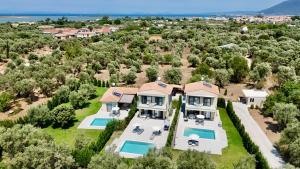 an aerial view of a house with a swimming pool at Anmaria Luxury in Lefkada