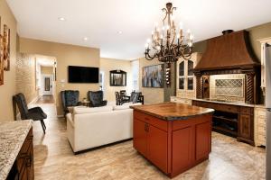 a living room with a couch and a fireplace at Historic Main St Apt | Private Garage in St. Charles