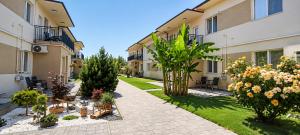 a courtyard of a building with plants and trees at Vig Apartments in Timişoara