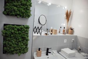 a bathroom with a sink and a mirror at Gudere house in Enfield Lock