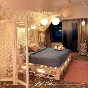 a bedroom with a large bed with a canopy at La Vida Dahab in Dahab