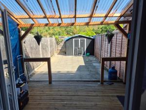 a view from the inside of a house with a glass door at 2BR home in Twickenham in Hounslow