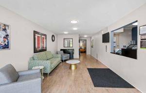 a living room with a couch and a table at Extended Stay America Suites - Fort Wayne - North in Fort Wayne