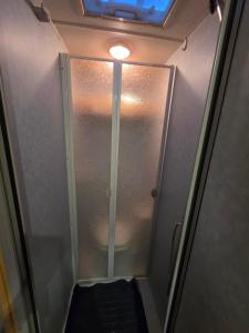 a shower stall with a glass door in a bathroom at Sterling Leisure in Ferryhill