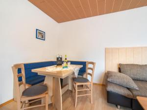 a room with a table and chairs and a bed at Haus Sporer in Gerlosberg +21 photos
