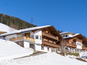 a chalet in the mountains in the snow at Haus Sporer in Gerlosberg