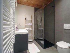 a bathroom with a shower and a sink and a toilet at Seeblick am Pressegger See in Lake Pressegg +12 photos
