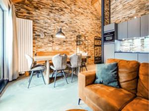 a living room with a couch and a table at Seeblick am Pressegger See in Lake Pressegg