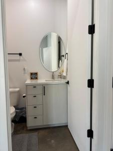 a bathroom with a sink and a mirror at Lazy G Ranch Casita  +25 photos