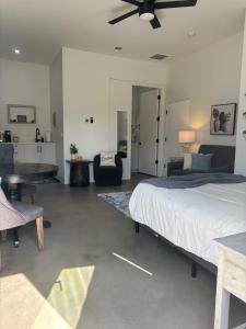 a bedroom with a bed and a table and a couch at Lazy G Ranch Casita 