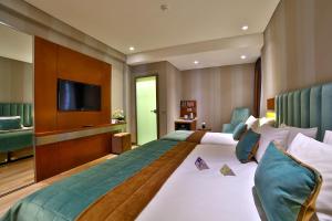 En eller flere senge i et værelse på The Tango Hotel İstanbul