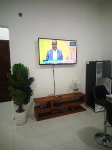 a flat screen tv hanging on a wall at JF Condominio 