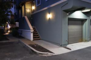 a house with a staircase next to a garage at Midnight Modern in San Jose