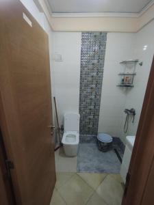 a bathroom with a toilet and a shower at Comp al Farah in Tangier