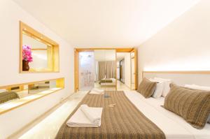 a bedroom with a large white bed with a large window at Villa Studio Deluxe Kalkan in Kaş +40 photos
