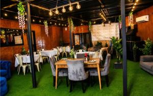 a dining room with a table and chairs and a table and chairsktop at The Bliss Boutique in Louis Trichardt