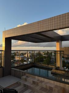 a view of a building with a swimming pool at Studio Luxuoso com vista surpreendente in Macapá