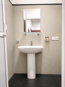 a bathroom with a white sink and a mirror at Amore Beach Resort in Balapitiya +84 photos