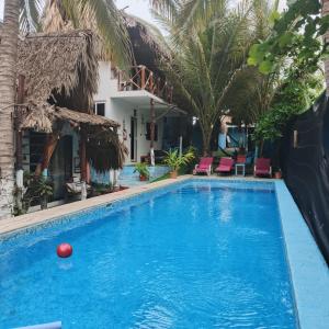 a pool at a hotel with a red ball in it at El Puente in El Paredón Buena Vista