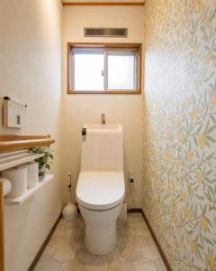 a bathroom with a white toilet in a room at Forest Agata in Matsumoto +47 photos