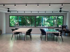a dining room with a table and chairs at The Regent Phuket Bangtao Beach in Bang Tao Beach
