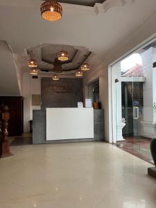 a large lobby with a white sign on the wall at White Castle in Siem Reap +11 photos