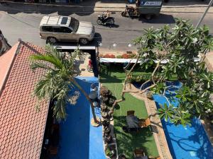an aerial view of a resort with a swimming pool at White Castle in Siem Reap