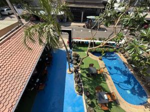 an aerial view of a resort swimming pool at White Castle in Siem Reap