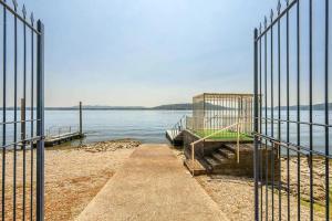 a gate on a pier next to a body of water at Villa Lago Maggiore in Lesa