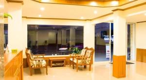 a dining room with a table and chairs at Loei Residence in Ban Tha Phae