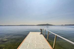 a dock in the middle of a body of water at Villa Lago Maggiore in Lesa +29 photos
