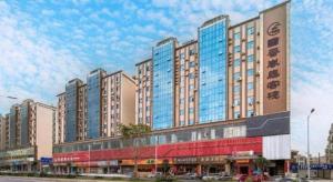a large building with many windows on a street at BOOK PAVILION HOTEL in Dongguan