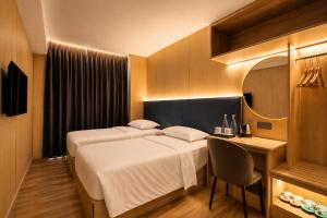Giường trong phòng chung tại Hotel Ming Star
