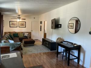 a living room with a couch and a table at Sunsets and City Lights 3BD 2Bath in Miramonte