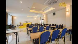 a conference room with blue chairs and desks in it at The La-Ngu Boutique in Langu