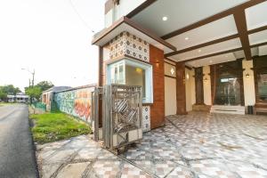 a building with a gate in front of it at Bintang Samudra Hotel in Jepara