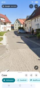 a picture of a street with houses and a car at Charmante Doppelhaushälfte in Tuttlingen