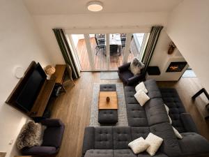 an overhead view of a living room with a couch and chairs at SNOW LAKE Lipno in Lipno nad Vltavou