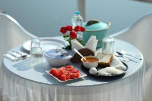 a table with a plate of food on a table at Sattva camps and cottages - Udupi in Udupi