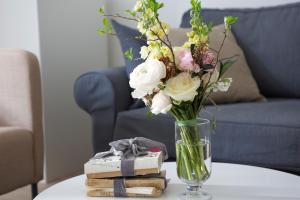 
a vase filled with flowers on top of a table at Premium Class Apartments in Zagreb
