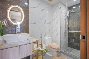 a bathroom with a sink and a shower at Homecrown Relaxscape in Tagaytay