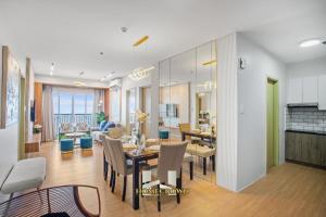 a dining room and living room with a table and chairs at Homecrown Relaxscape in Tagaytay